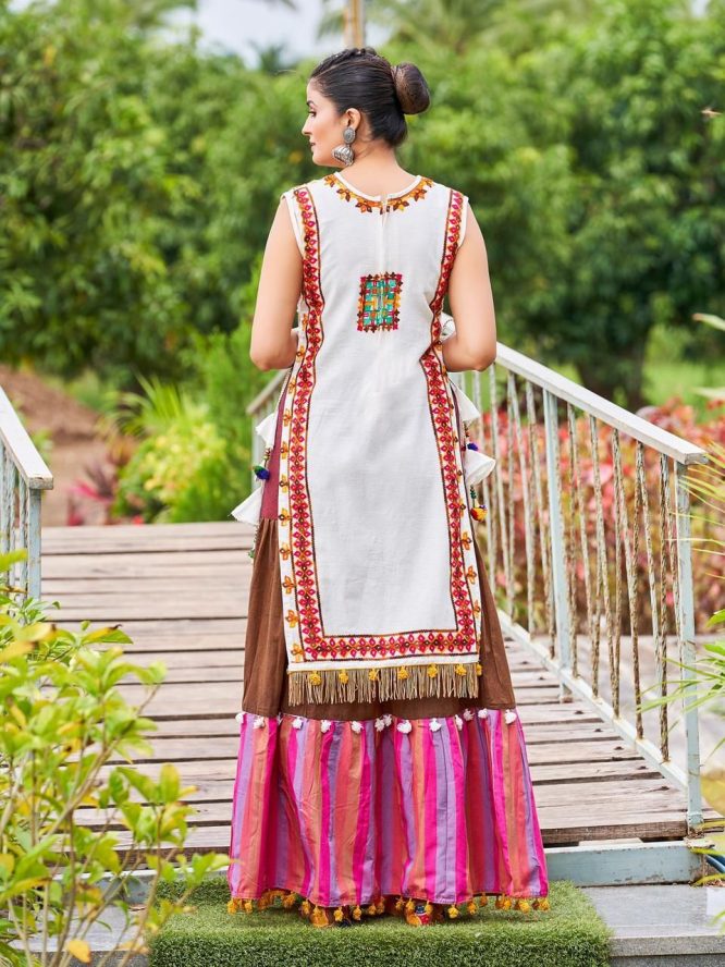 Luxurious Off White Dhingli Motif Embroidered Panel Top Paired With Wine Trendy Printed Skirt