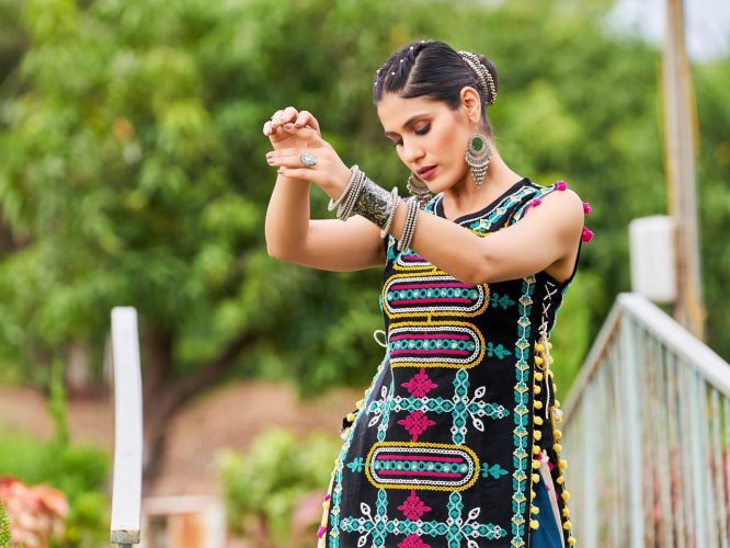 Luxurious Off White Dhingli Motif Embroidered Panel Top Paired With Wine Trendy Printed Skirt